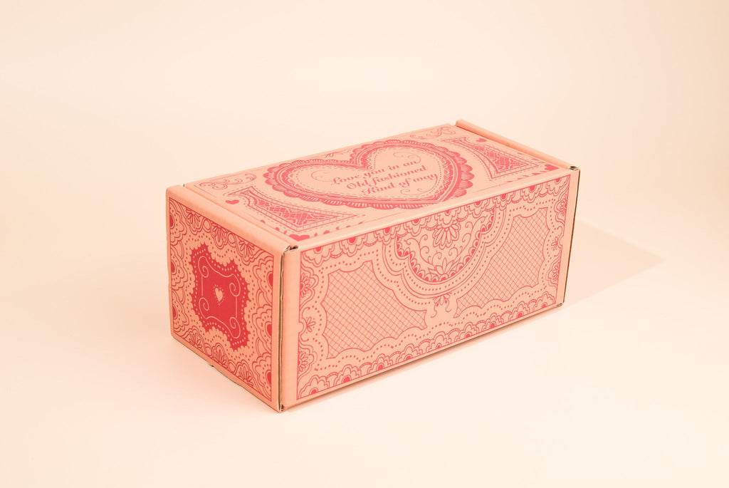An image of the valentines day cookie box on a cream background.