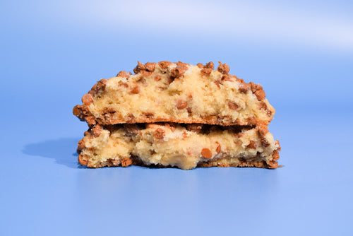 Keksi Caramel Apple Spice cookie split in half and stacked to show the spiced apple center