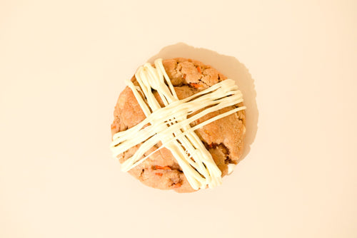 Keksi Carrot Cake cookie from above with a cream cheese icing drizzle