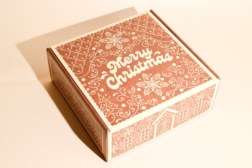 An image of Keksi's gingerbread themed Christmas cookie box on a cream background.