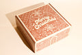 An image of Keksi's gingerbread themed Christmas cookie box on a cream background.
