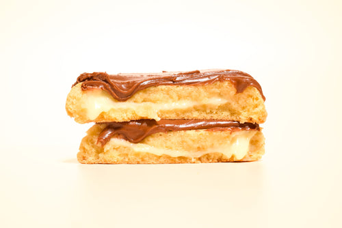 Boston Cream Pie cookie cut open to show the vanilla custard filling