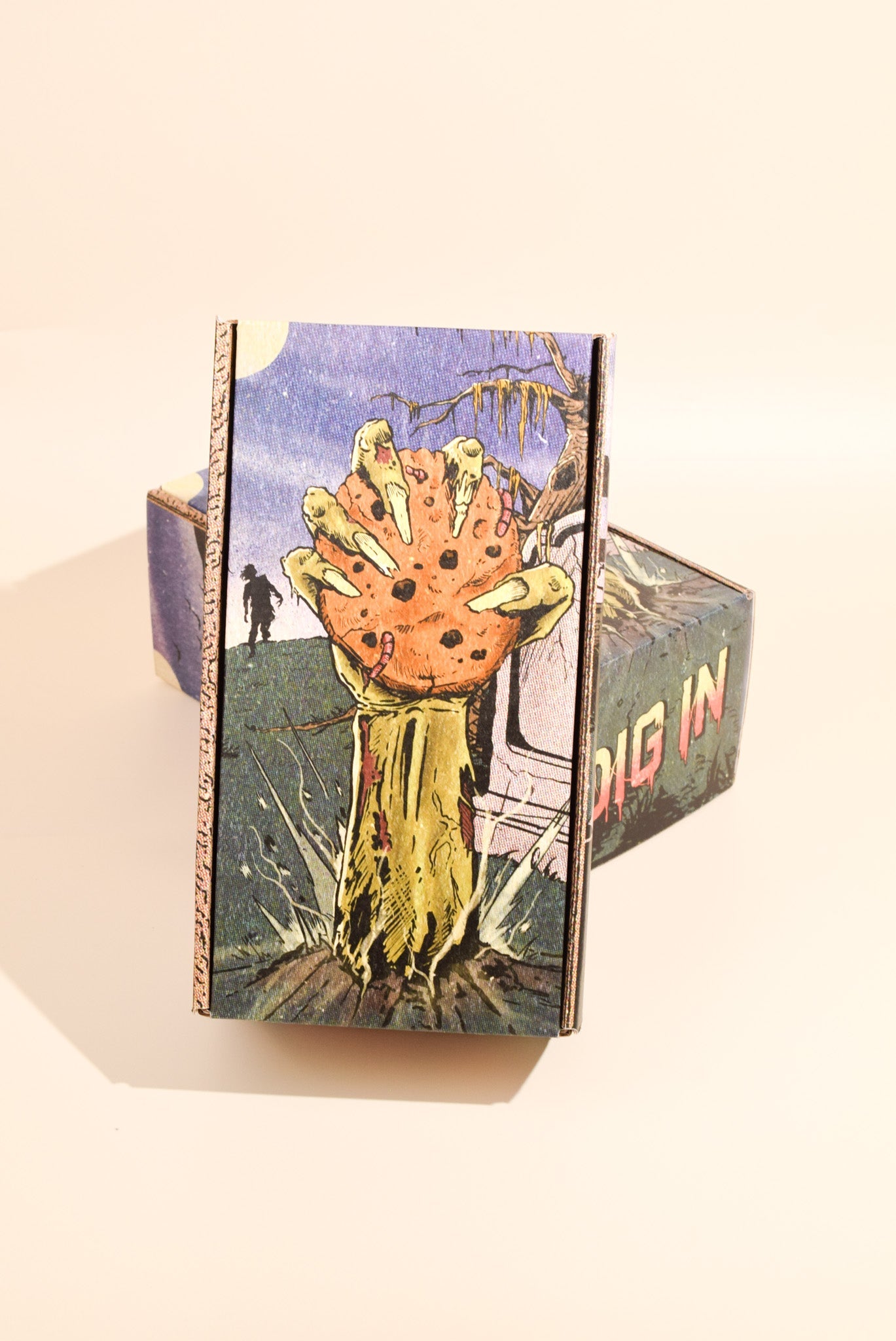 An image of Keksi's Halloween themed cookie box on a cream background.