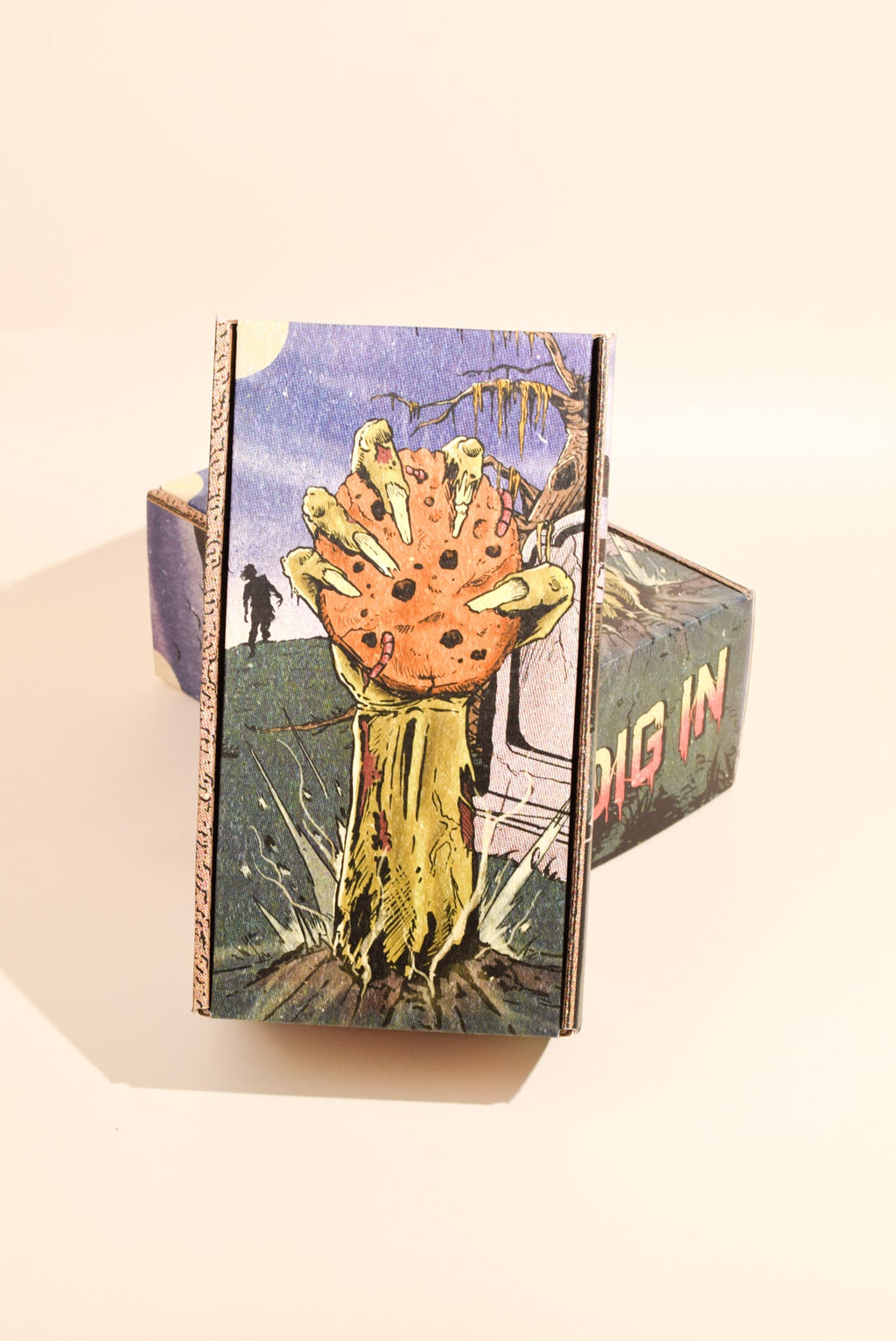An image of Keksi's Halloween themed cookie box on a cream background.
