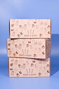 Three Birthday Cookie boxes stacked on top of each other on a blue background