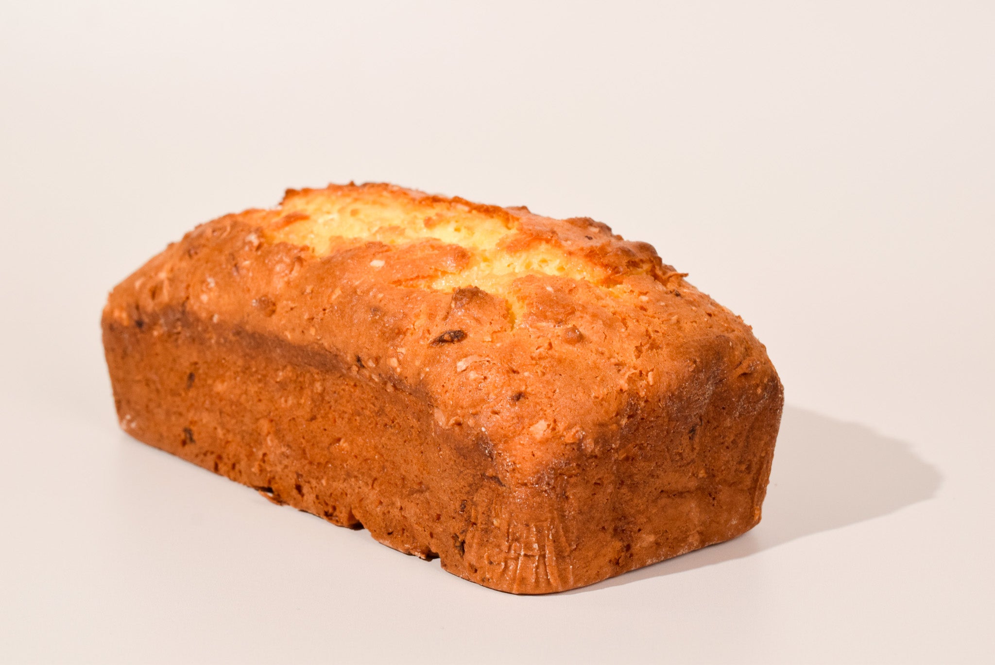 Loaf of Hawaiian Coconut bread on a white background