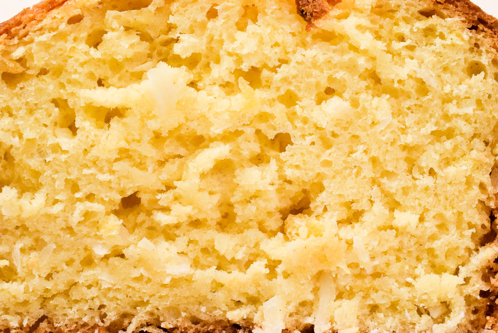 Close-up of a slice of Hawaiian Coconut bread with a porous texture