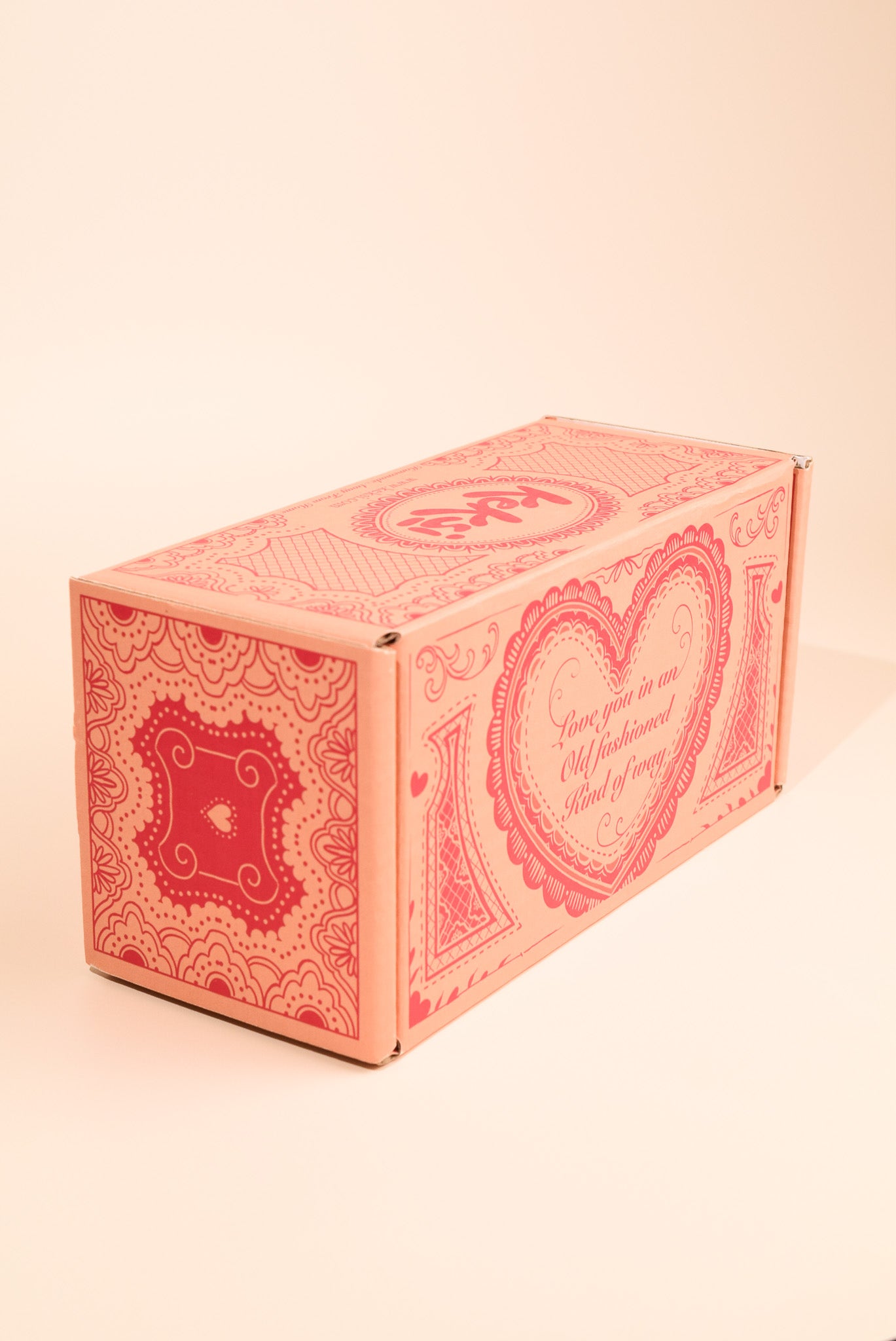 An image of the valentines day cookie box on a cream background.