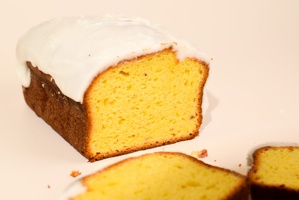 A close up of the keksi Lemon Loaf on a cream background.