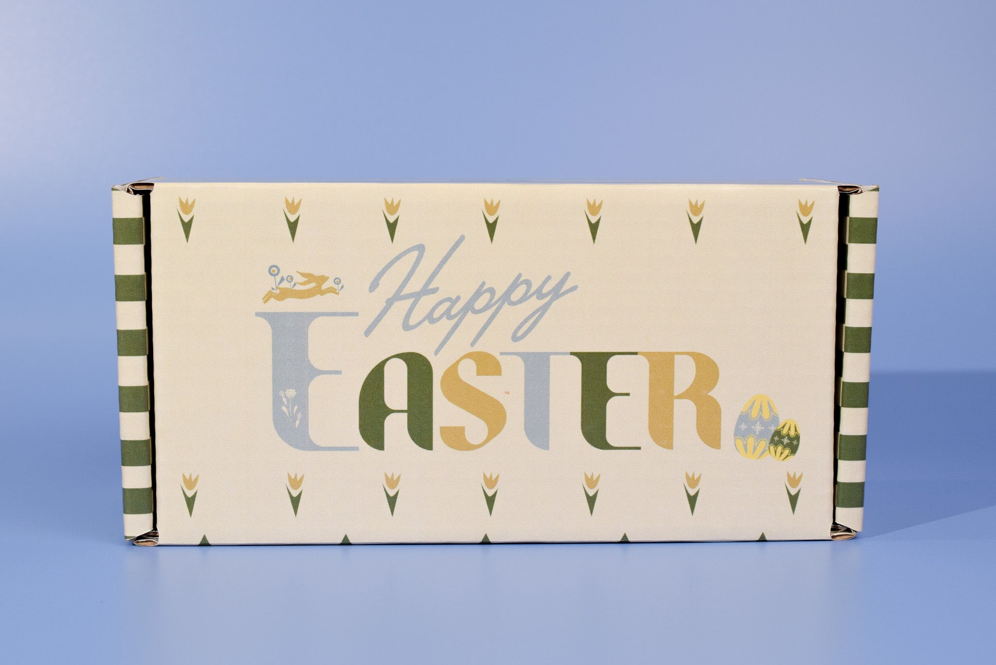 The Easter themed cookie box on a blue background.