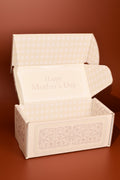 Decorative box with 'Happy Mother's Day' text on a brown background