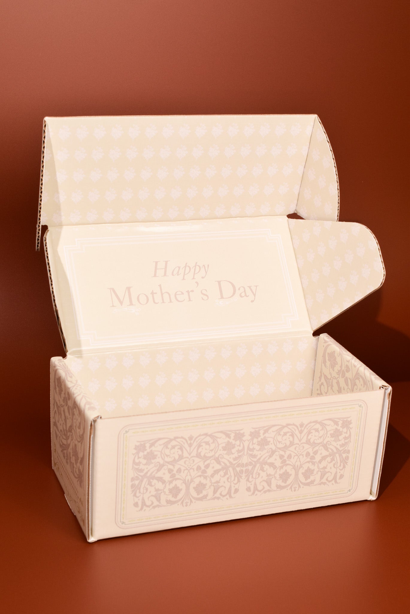 Decorative box with 'Happy Mother's Day' text on a brown background