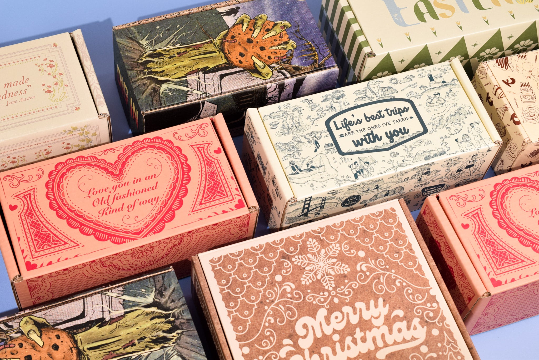 Collection of decorative boxes with various designs and text on a blue background