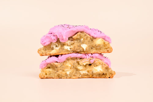 Two Blackberry Honey Cookies stacked on a cream background.