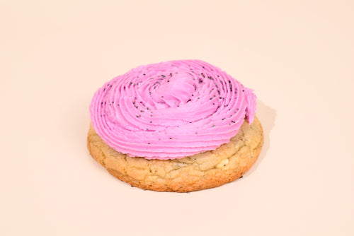 A Keksi Blackberry Honey Cookie on a cream background.