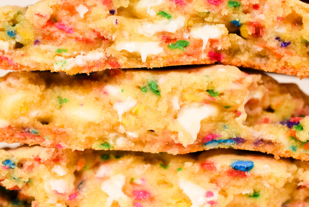A close up of cut open Birthday cake cookies.