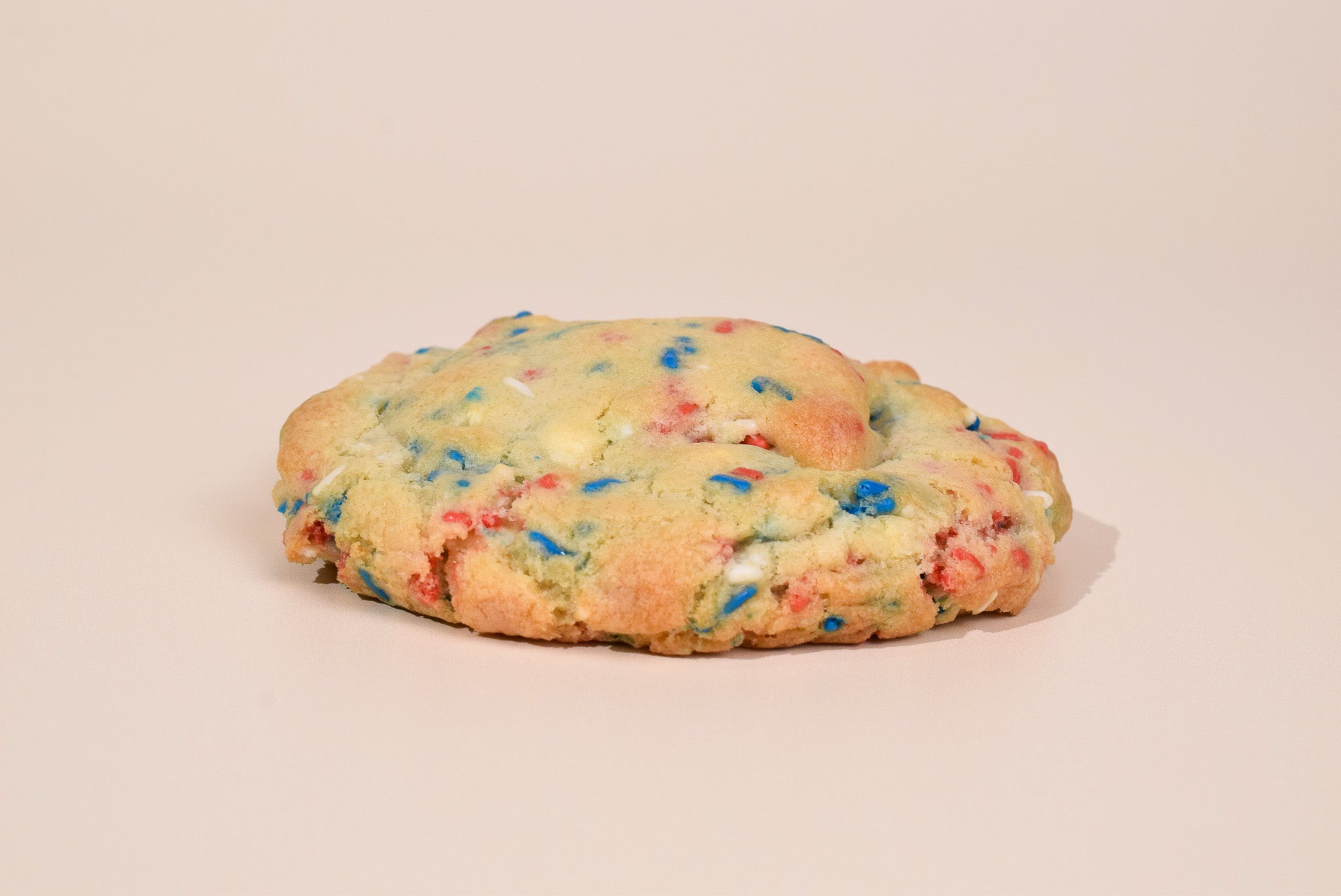 The 4th of July Sprinkles Sugar Cookie on a beige background.