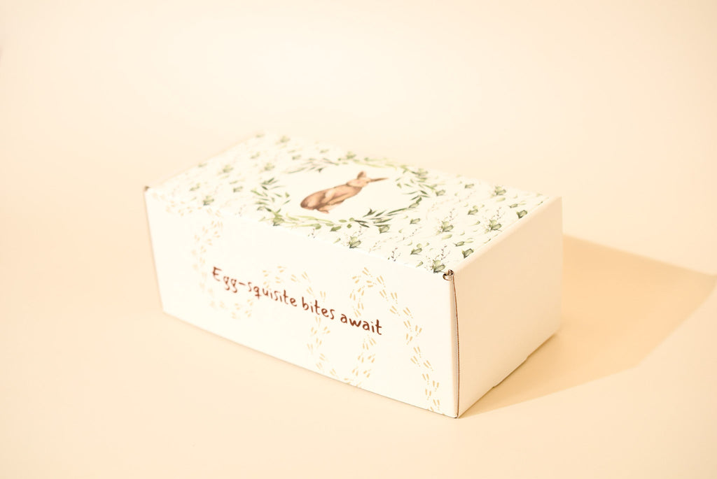 An image of Keksi's Easter themed cookie box on a cream background.