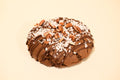 A German Chocolate cookie on a cream background.